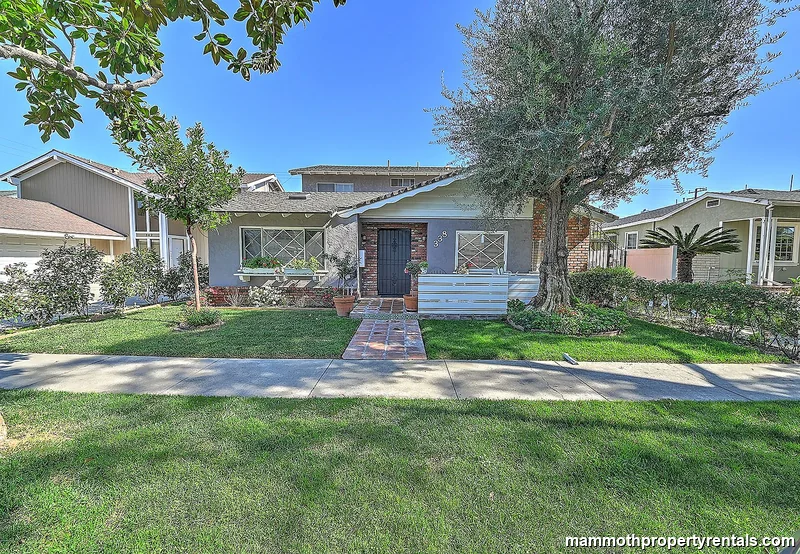 Front view of the 4-plex at 338 Orizaba Ave - Unit 2 is the downstairs rental behind the secured gate on the right.