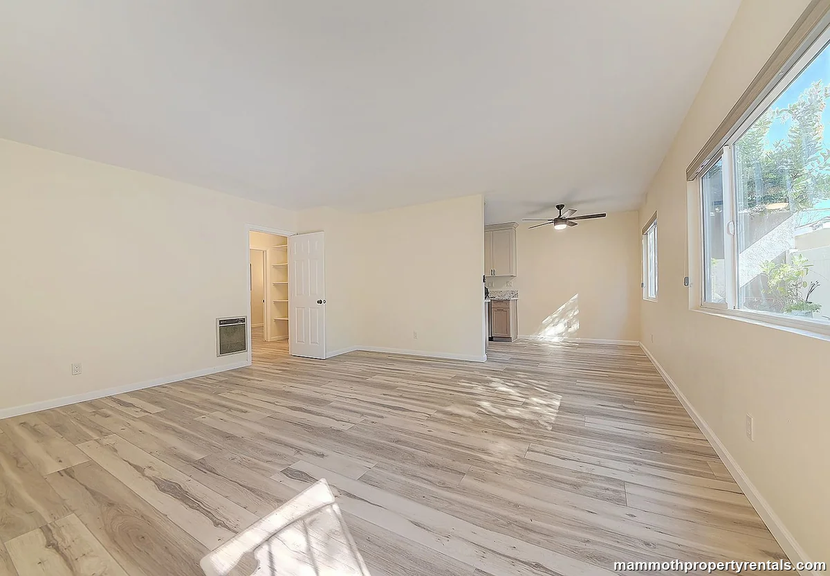 Living and dining area with high ceilings at Bluff Heights Historic Gem Apt