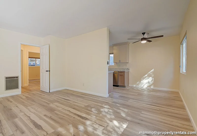 Open-concept living and dining area - a versatile, light-filled space ideal for midterm rental guests.