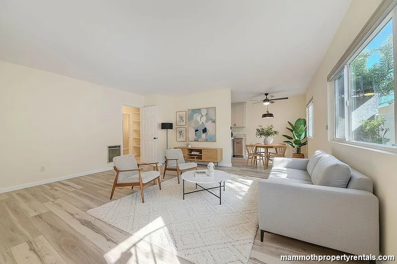 Living and dining area showing the full open-concept layout - great for entertaining or everyday living.