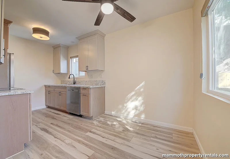 Kitchen view showing the stove, microwave, and counter space - fully equipped for daily cooking.