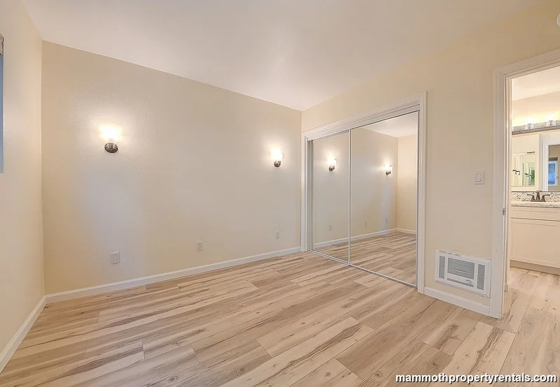 Second bedroom - second angle highlighting natural light and practical layout.