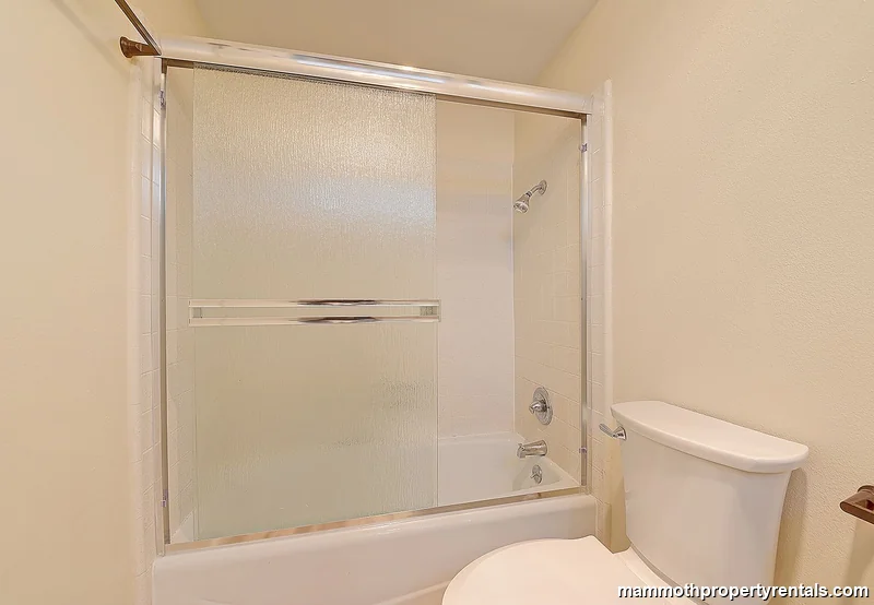 Guest bathroom - clean and updated with fresh fixtures and modern tile.